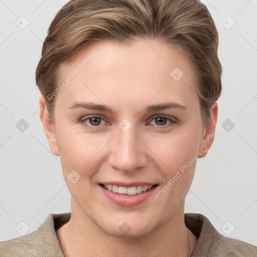 Joyful white young-adult female with short  brown hair and grey eyes