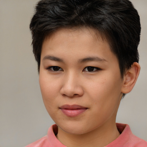 Joyful asian young-adult female with short  brown hair and brown eyes