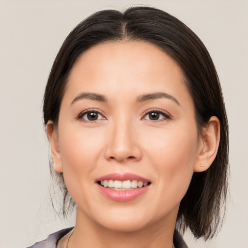 Joyful white young-adult female with medium  brown hair and brown eyes