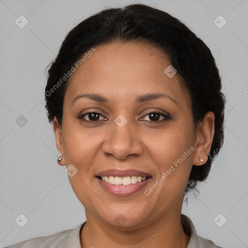 Joyful latino adult female with short  brown hair and brown eyes