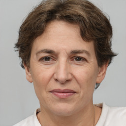 Joyful white adult female with short  brown hair and brown eyes