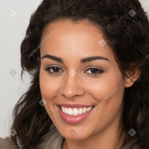 Joyful latino young-adult female with long  brown hair and brown eyes