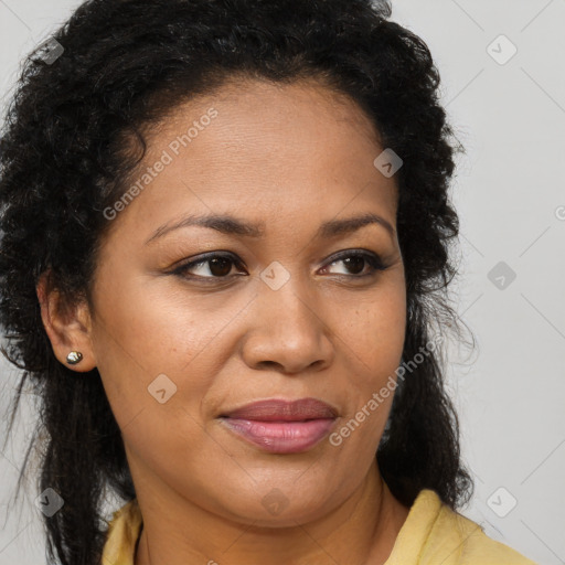 Joyful black young-adult female with long  brown hair and brown eyes