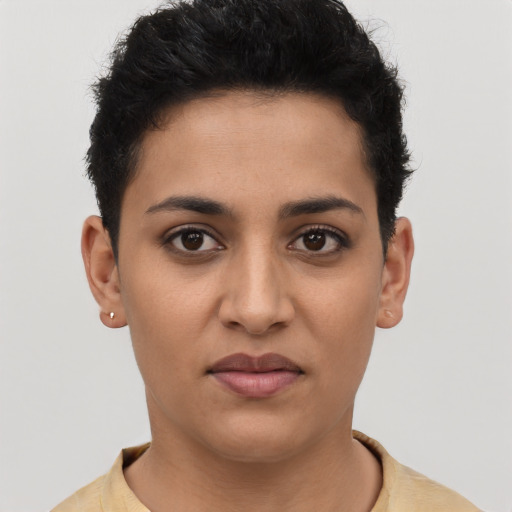 Joyful latino young-adult female with short  black hair and brown eyes