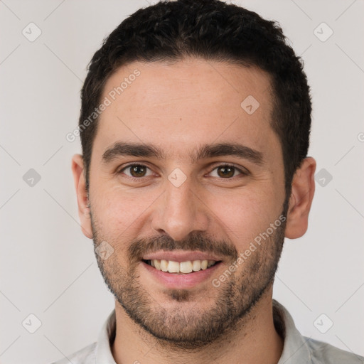 Joyful white young-adult male with short  black hair and brown eyes