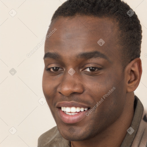 Joyful black young-adult male with short  brown hair and brown eyes