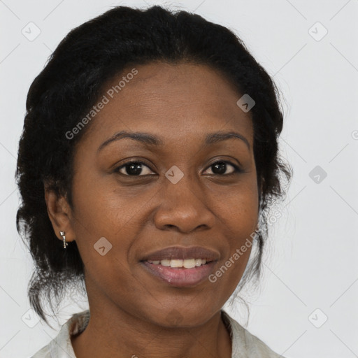 Joyful black adult female with medium  brown hair and brown eyes