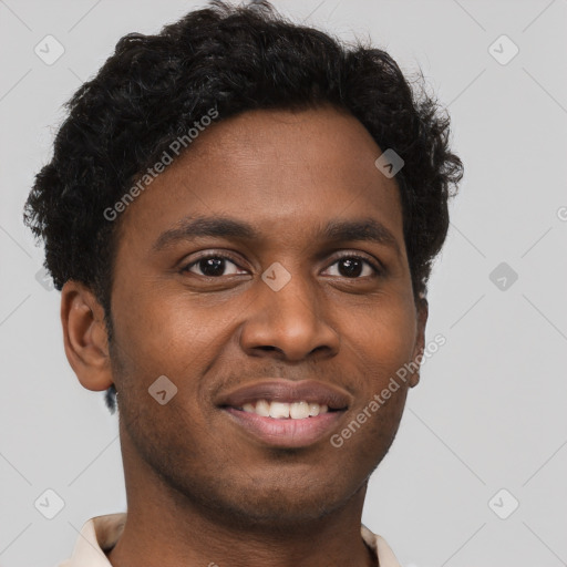 Joyful black young-adult male with short  brown hair and brown eyes