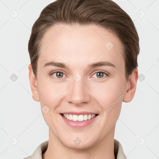 Joyful white young-adult female with short  brown hair and grey eyes