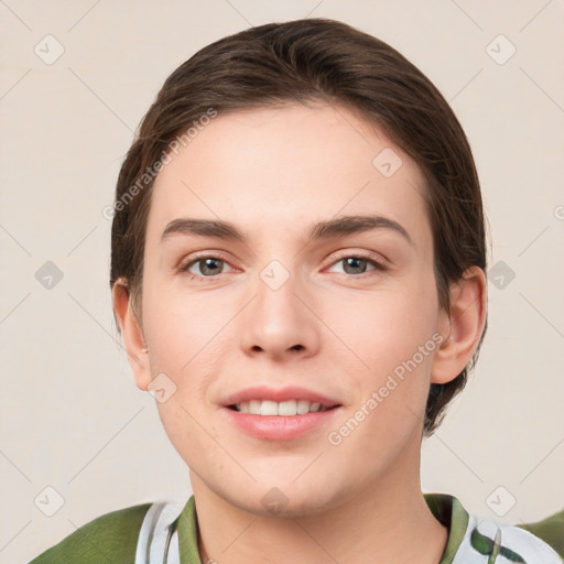 Joyful white young-adult female with medium  brown hair and green eyes