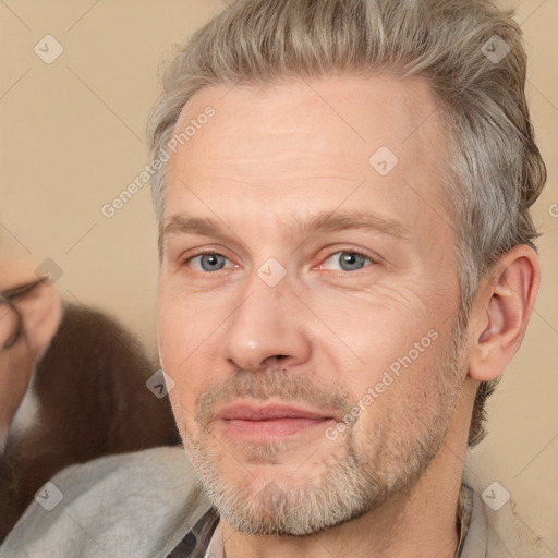 Joyful white adult male with short  brown hair and grey eyes