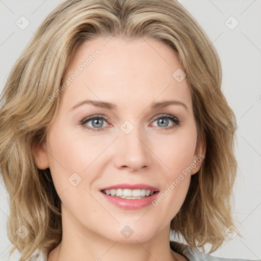 Joyful white young-adult female with medium  brown hair and blue eyes