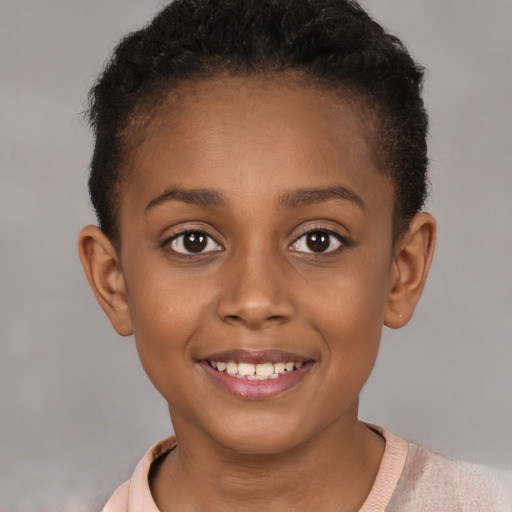 Joyful black child female with short  brown hair and brown eyes