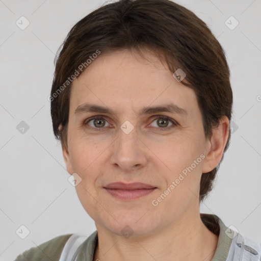 Joyful white adult female with short  brown hair and brown eyes