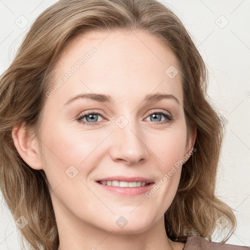 Joyful white young-adult female with long  brown hair and blue eyes