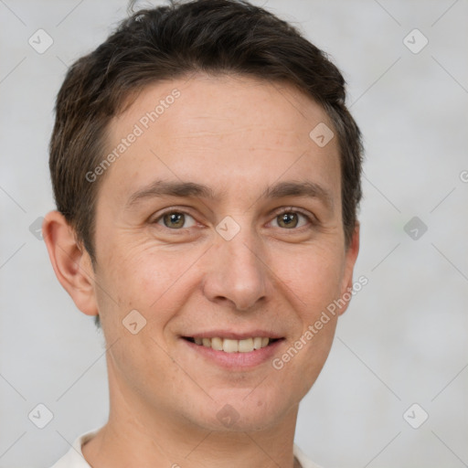 Joyful white adult male with short  brown hair and brown eyes