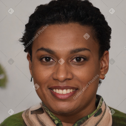 Joyful black young-adult female with short  brown hair and brown eyes