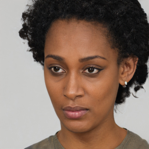 Neutral black young-adult female with short  brown hair and brown eyes