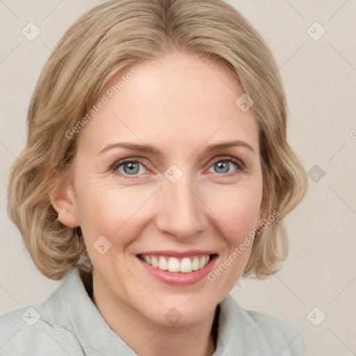 Joyful white young-adult female with medium  brown hair and blue eyes