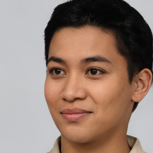 Joyful asian young-adult female with short  black hair and brown eyes