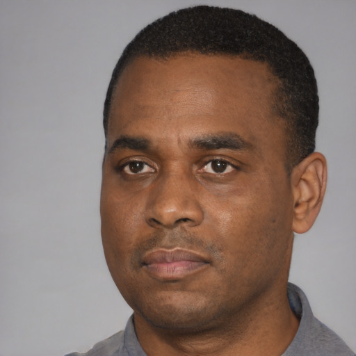 Neutral black young-adult male with short  black hair and brown eyes
