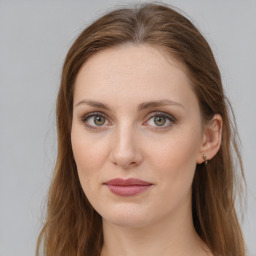 Joyful white young-adult female with long  brown hair and blue eyes