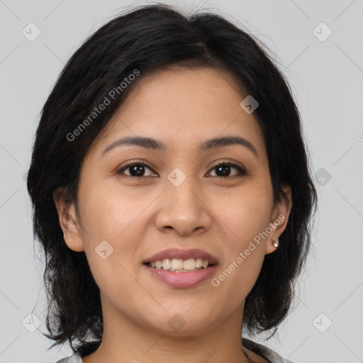 Joyful latino young-adult female with medium  brown hair and brown eyes