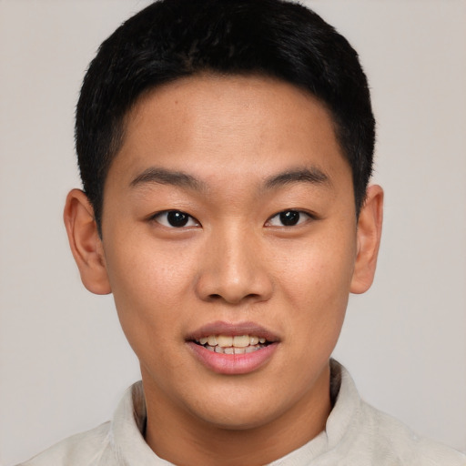 Joyful asian young-adult male with short  brown hair and brown eyes