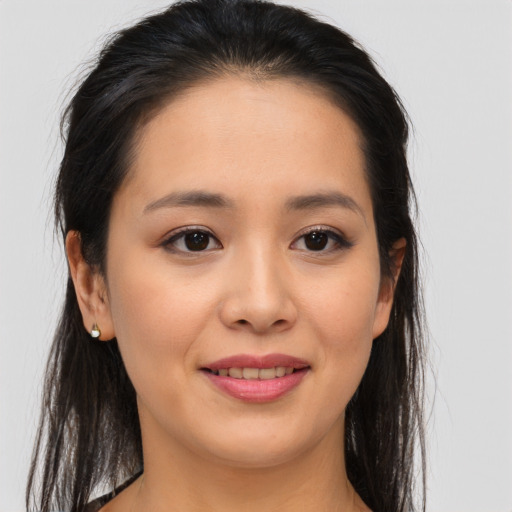Joyful asian young-adult female with long  brown hair and brown eyes