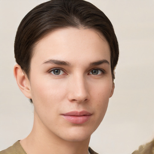 Neutral white young-adult female with short  brown hair and brown eyes