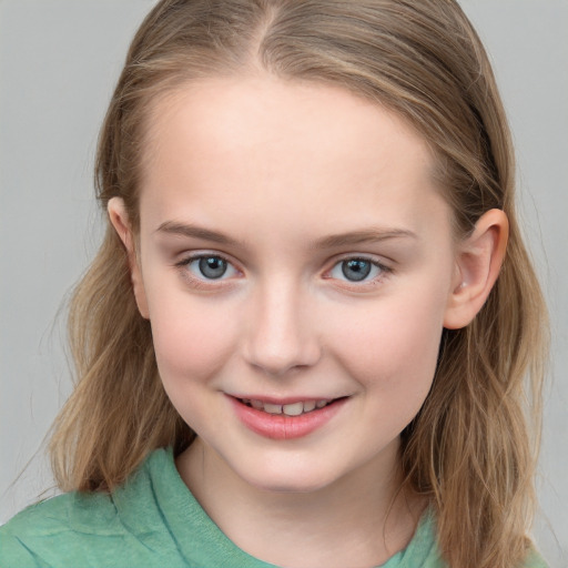 Joyful white child female with long  brown hair and blue eyes