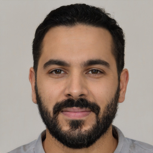 Neutral latino young-adult male with short  black hair and brown eyes