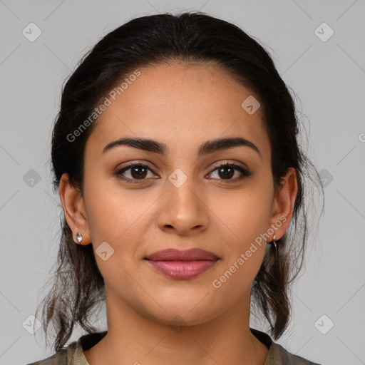 Joyful latino young-adult female with medium  brown hair and brown eyes