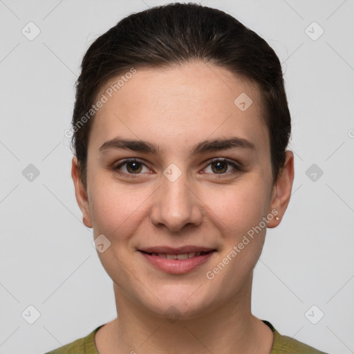 Joyful white young-adult female with short  brown hair and grey eyes