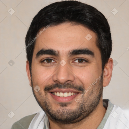 Joyful white young-adult male with short  black hair and brown eyes