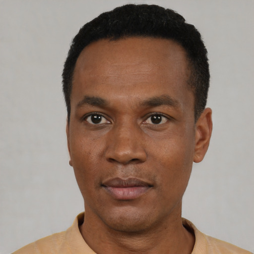 Neutral black young-adult male with short  black hair and brown eyes