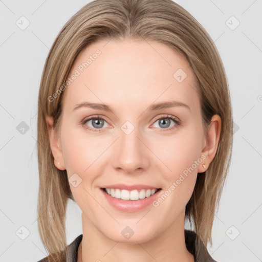 Joyful white young-adult female with long  brown hair and blue eyes