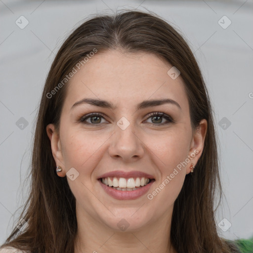 Joyful white young-adult female with long  brown hair and grey eyes