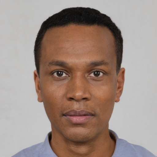 Neutral black young-adult male with short  black hair and brown eyes