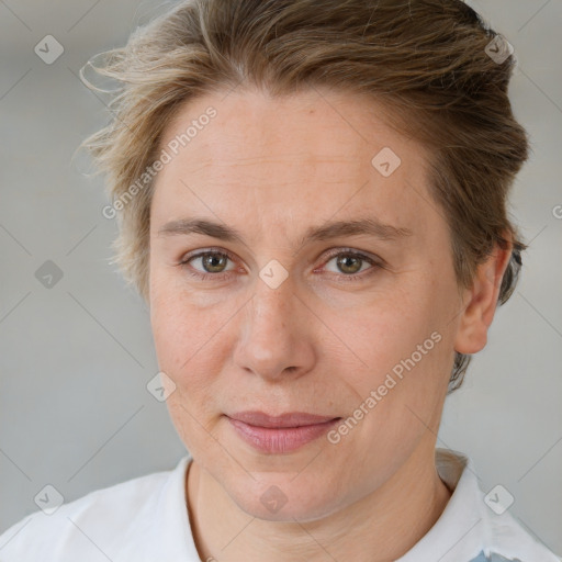 Joyful white adult female with short  brown hair and brown eyes