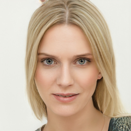 Joyful white young-adult female with medium  brown hair and blue eyes