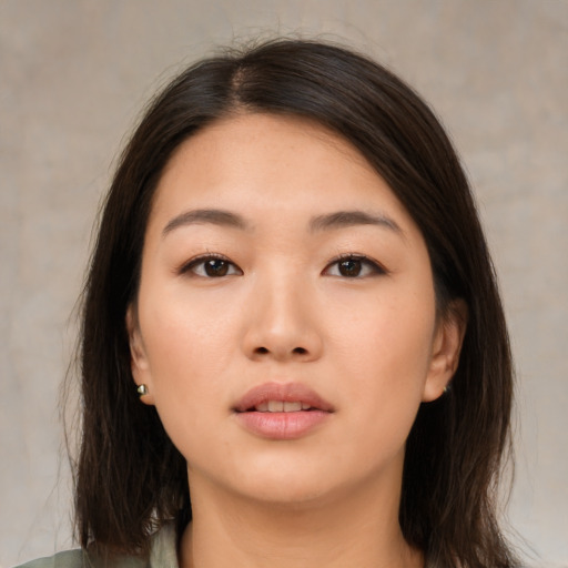 Neutral asian young-adult female with medium  brown hair and brown eyes