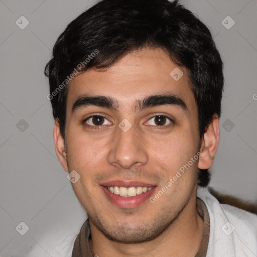 Joyful white young-adult male with short  black hair and brown eyes