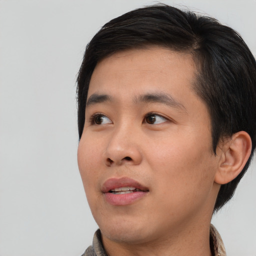 Neutral asian young-adult male with short  brown hair and brown eyes