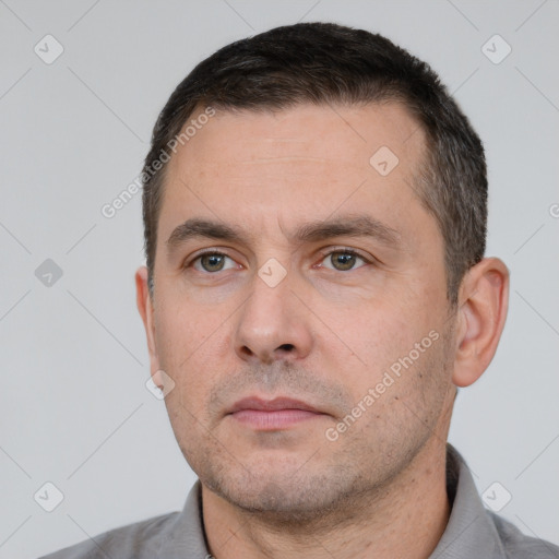 Neutral white adult male with short  black hair and brown eyes