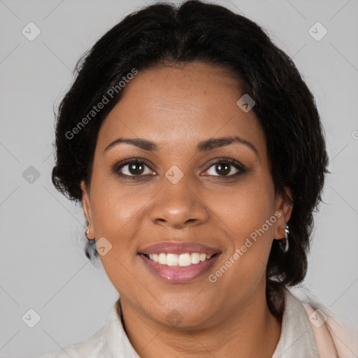 Joyful black adult female with medium  brown hair and brown eyes