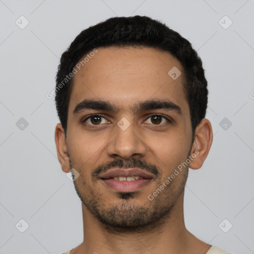 Joyful latino young-adult male with short  black hair and brown eyes