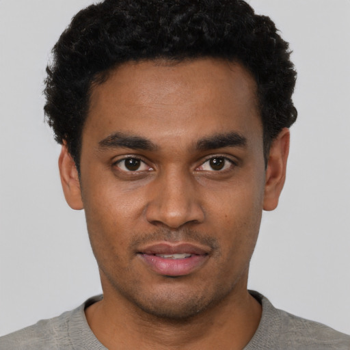 Neutral black young-adult male with short  black hair and brown eyes