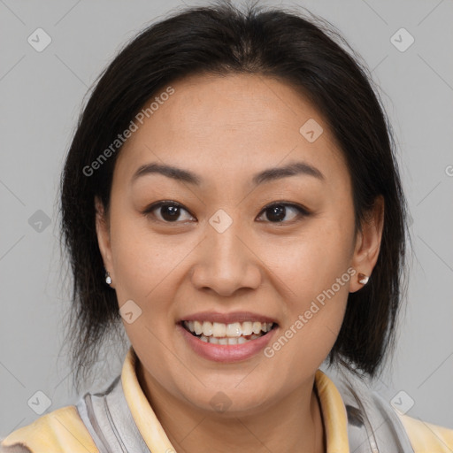 Joyful latino young-adult female with medium  brown hair and brown eyes