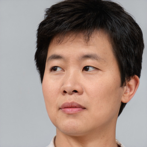 Neutral asian young-adult male with short  brown hair and brown eyes